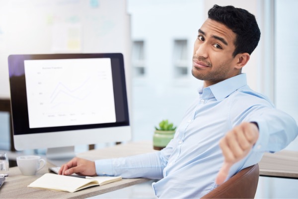 Woman shocked looking at paperwork